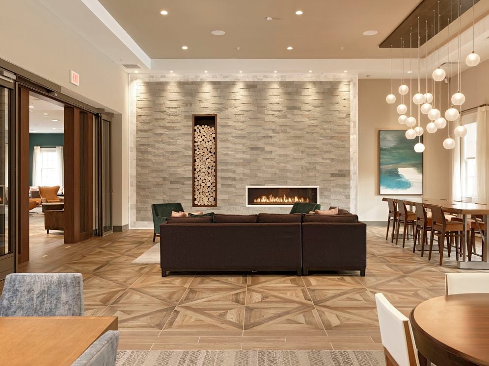 Resident lounge with fireplace and seating