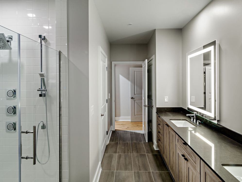 Penthouse-level Signature Collection apartment homes feature baths with upgraded finishes