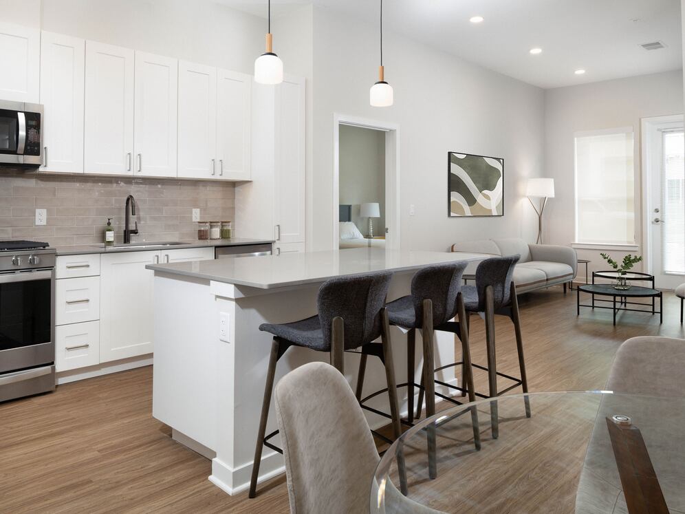 Upgrade Collection Kitchen, living, and dining areas with hard-surface vinyl plank flooring