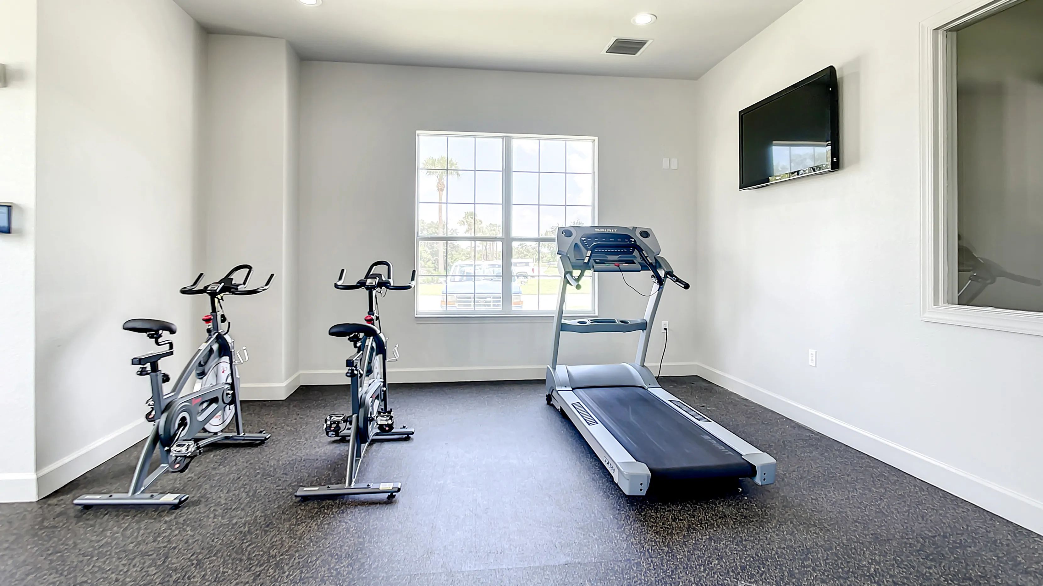 Our fitness center features a treadmill and spinning bikes, offering a gateway to heart health right outside your front door. 