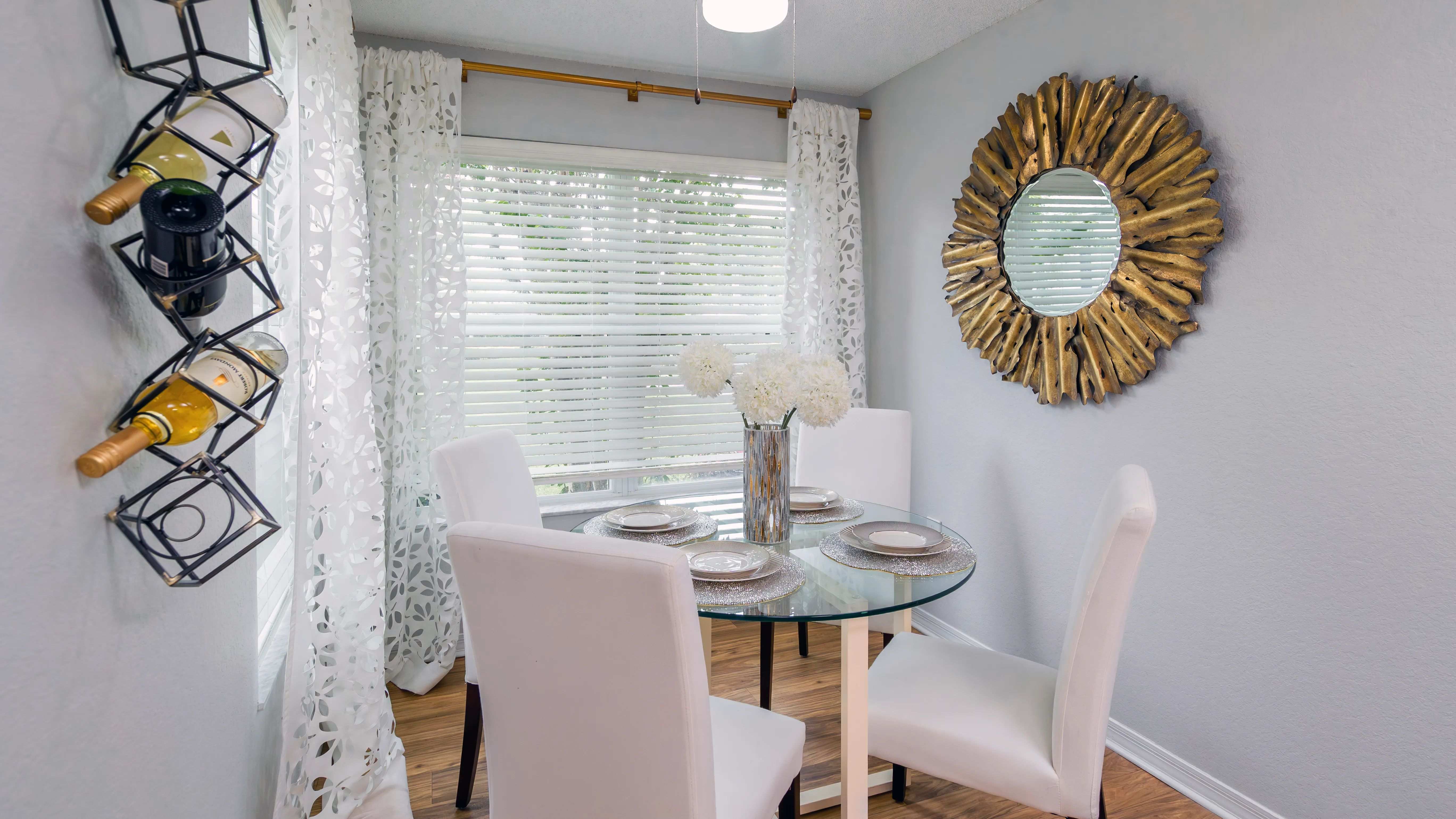Soak in natural light in this cozy solarium space which is perfect for a small dining table.