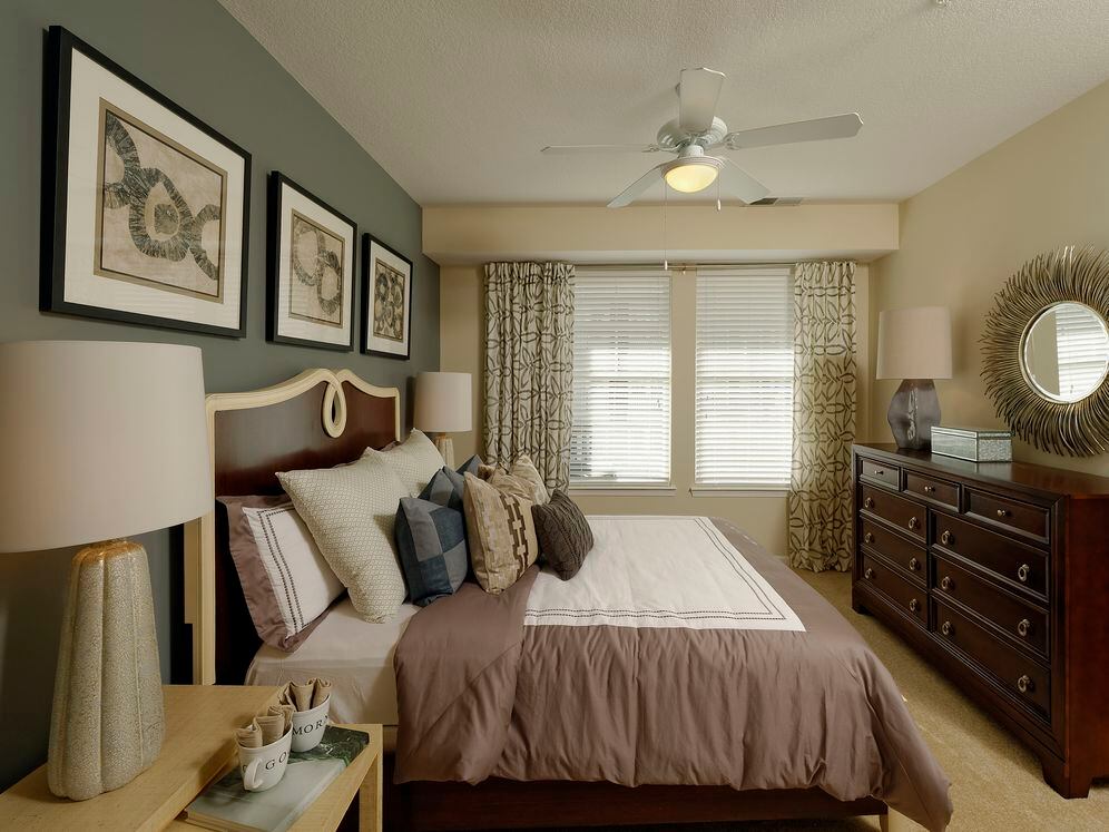Bedroom with accent wall and carpet