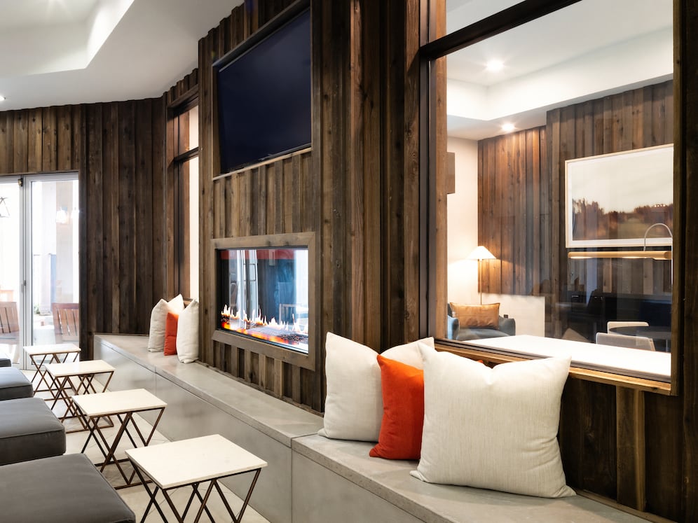 Lounge with multiple seating areas and fireplace