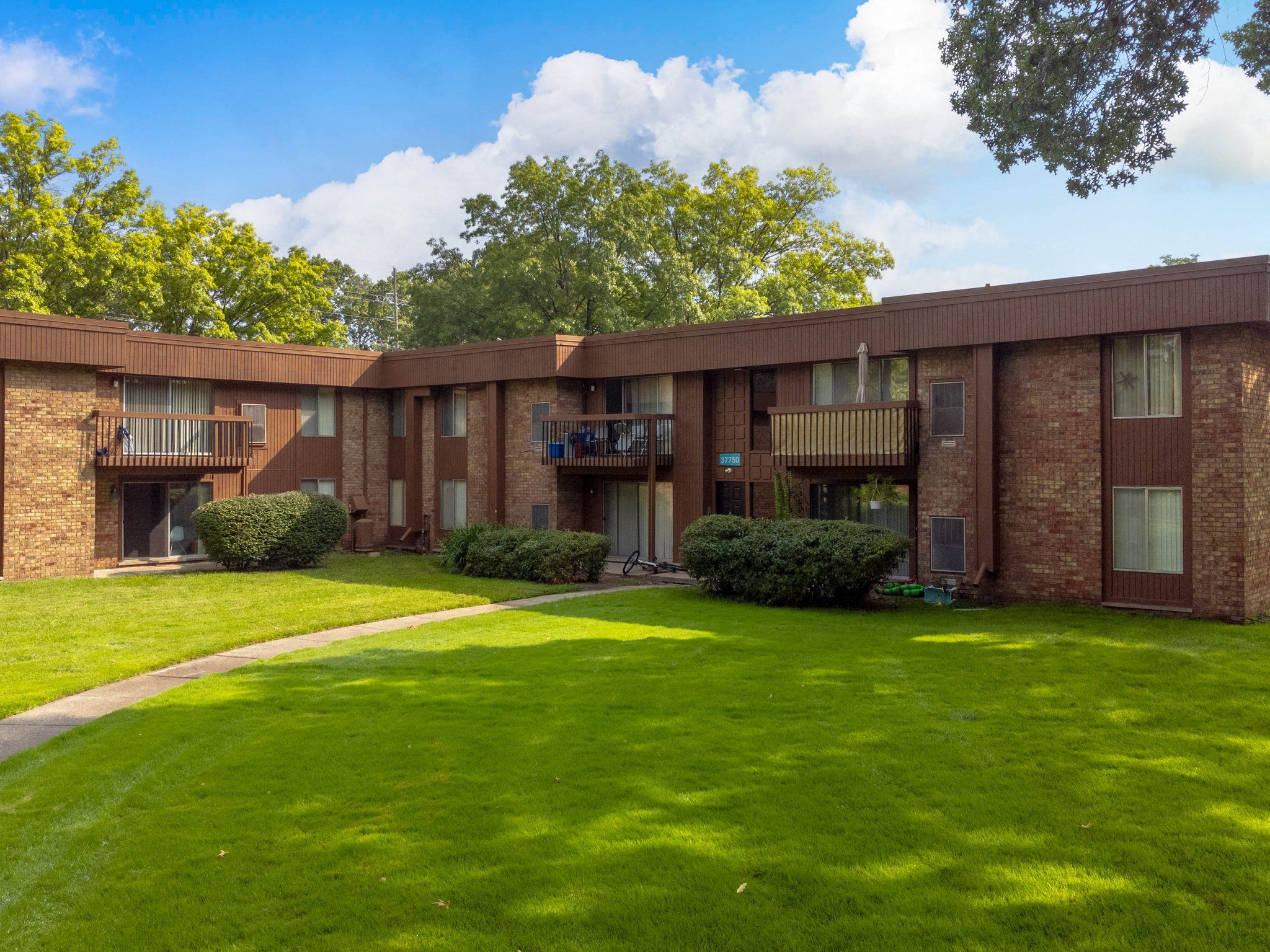 Cozy apartment Building Exterior at Westwood Village Apartments in Westland, MI