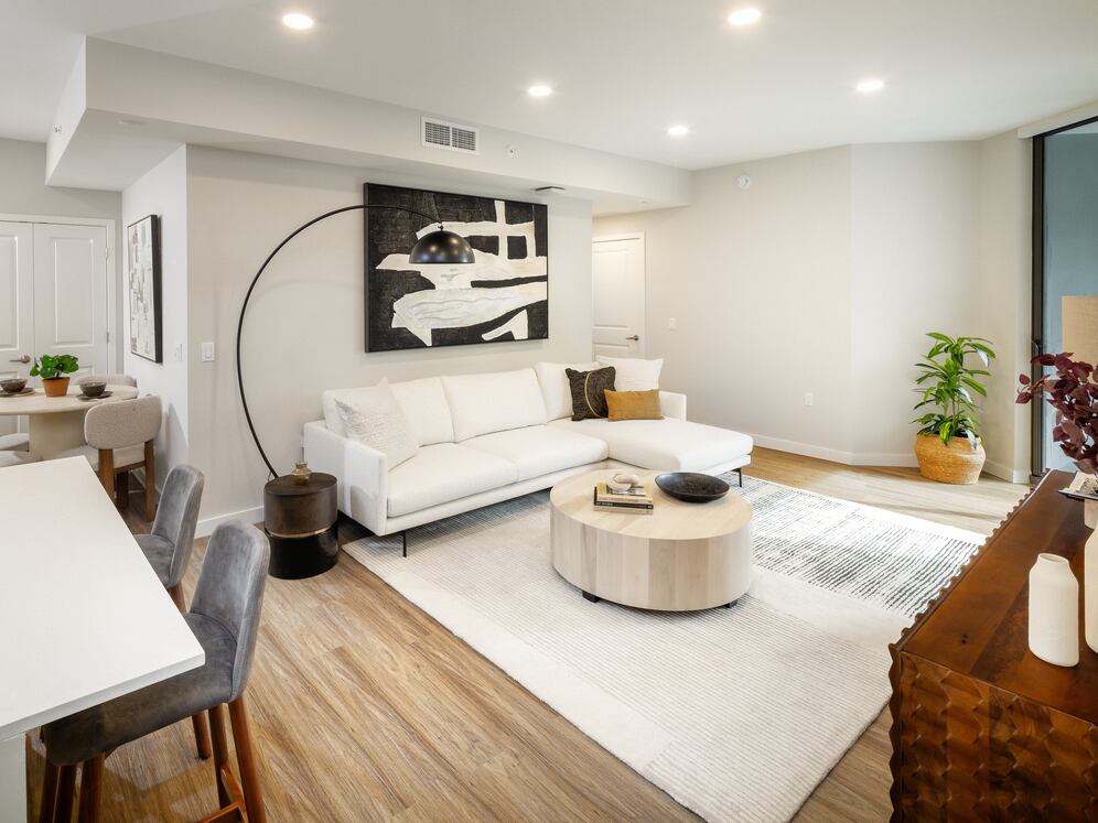 Kitchen, living, and dining areas with hard-surface vinyl plank flooring