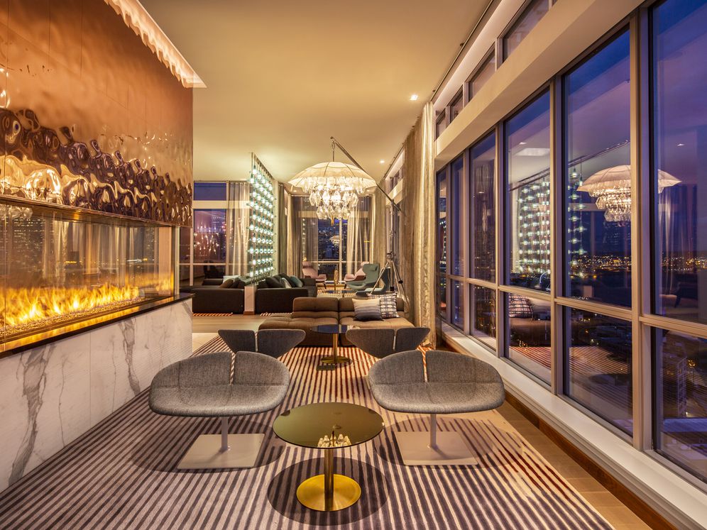24th floor Sky Lounge with fireplace and multiple seating areas.