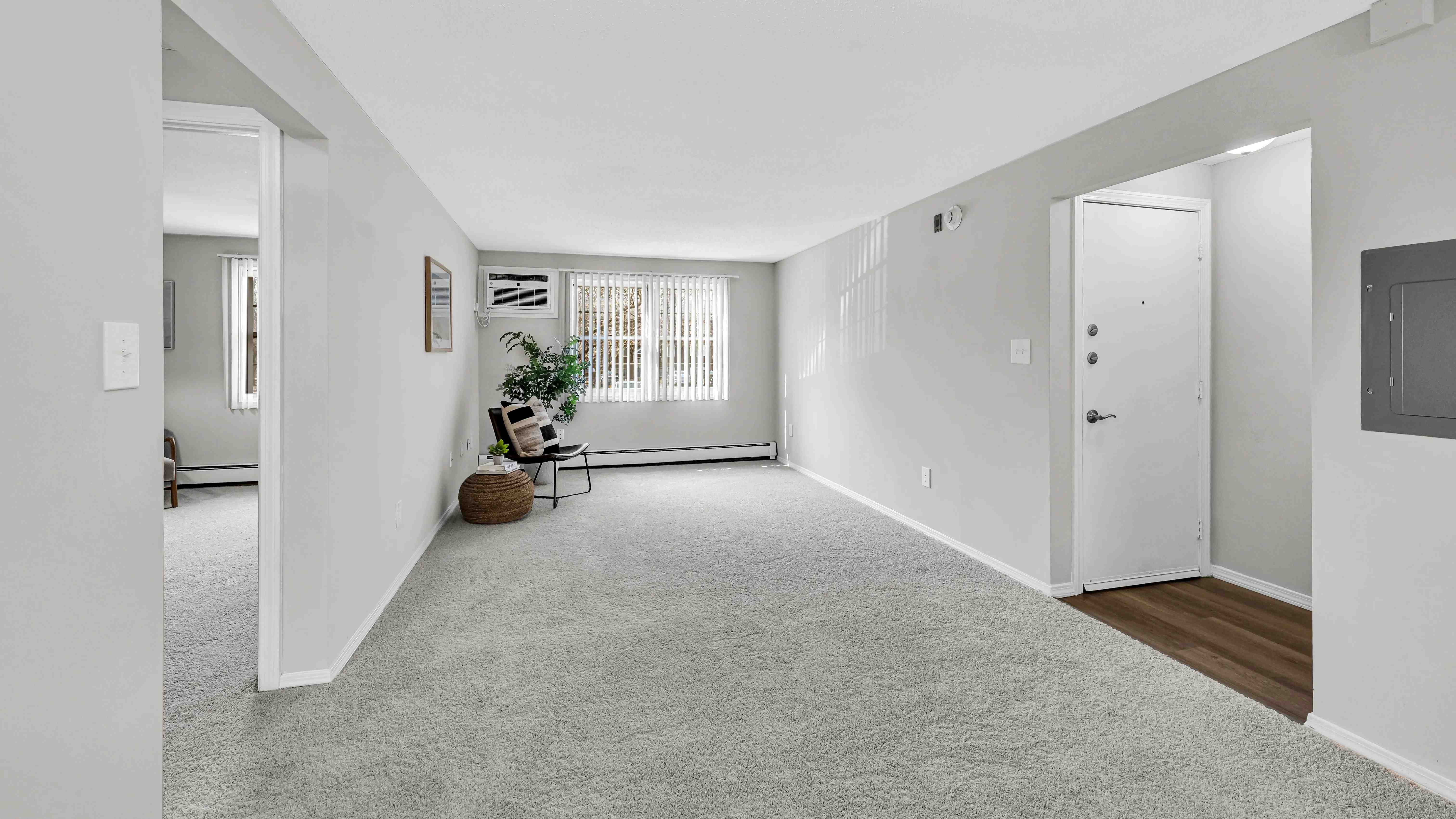 Unwind in your cozy living room with plush carpeting and large windows, your haven for relaxation. 