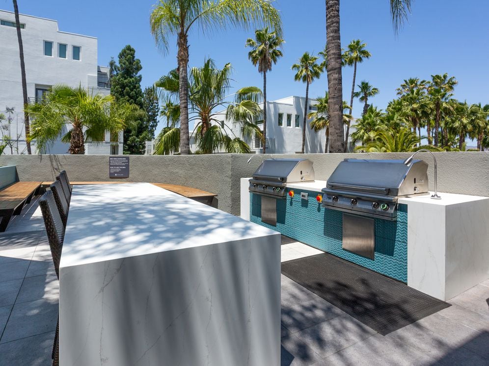 Pool deck with barbeque grills