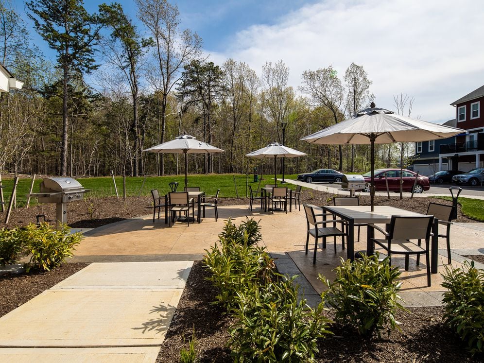 Courtyard with grill area and dining tables