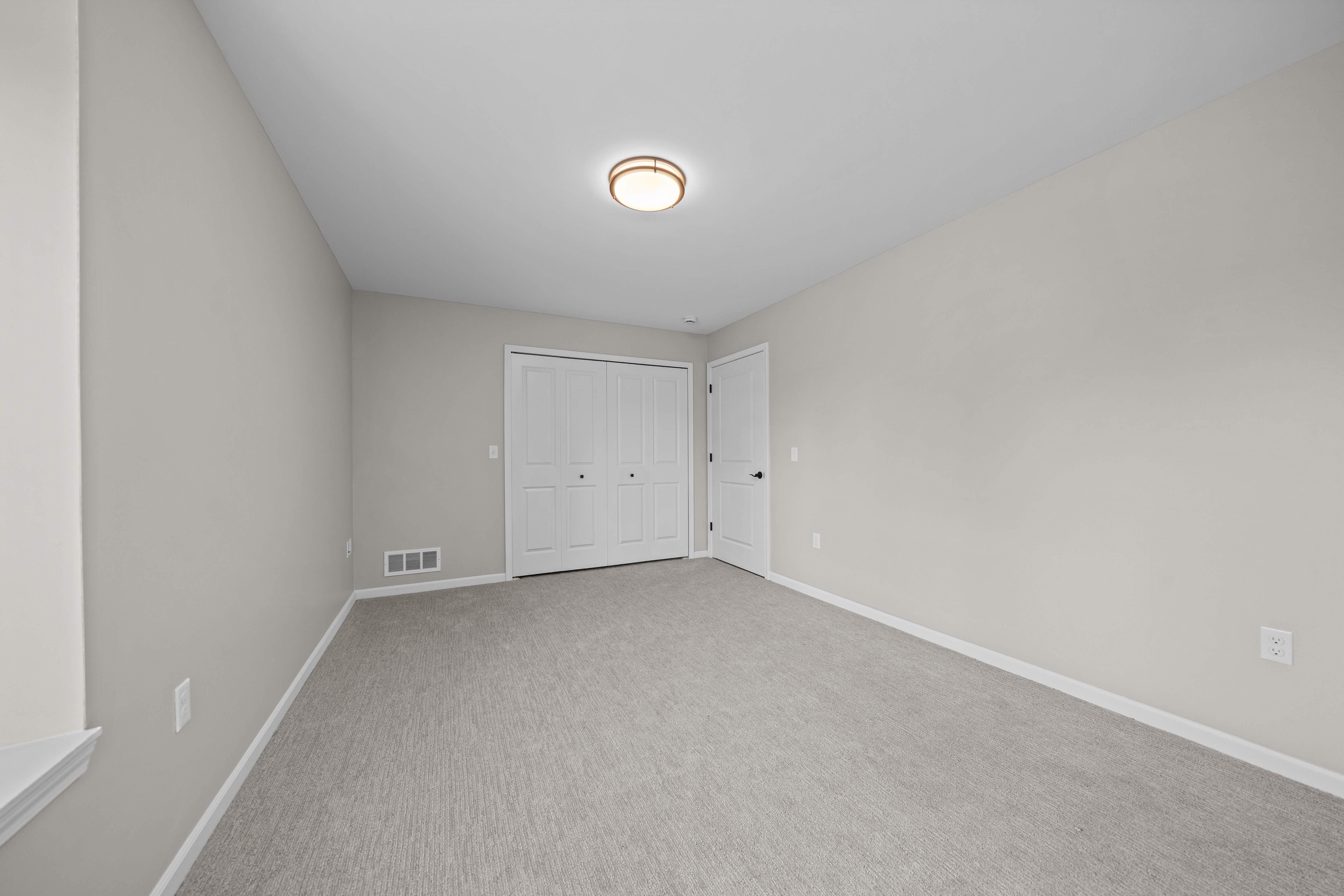 Bedroom with Ample storage space at The Reserve at Prentiss Pointe Apartments in Harrison Township, MI