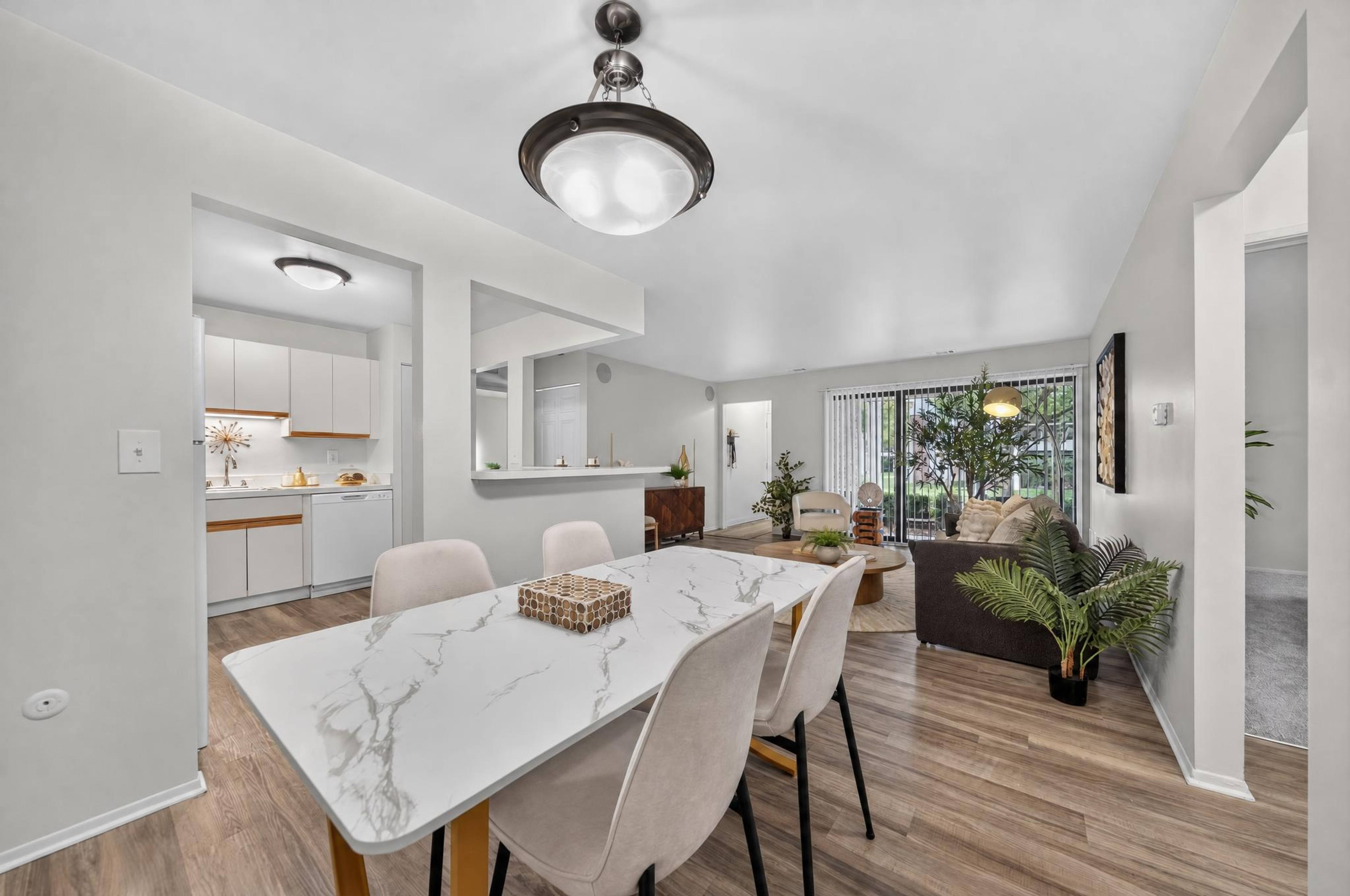 Open and airy kitchen, dining and living room space at Park Lane Apartments in Southfield, MI.