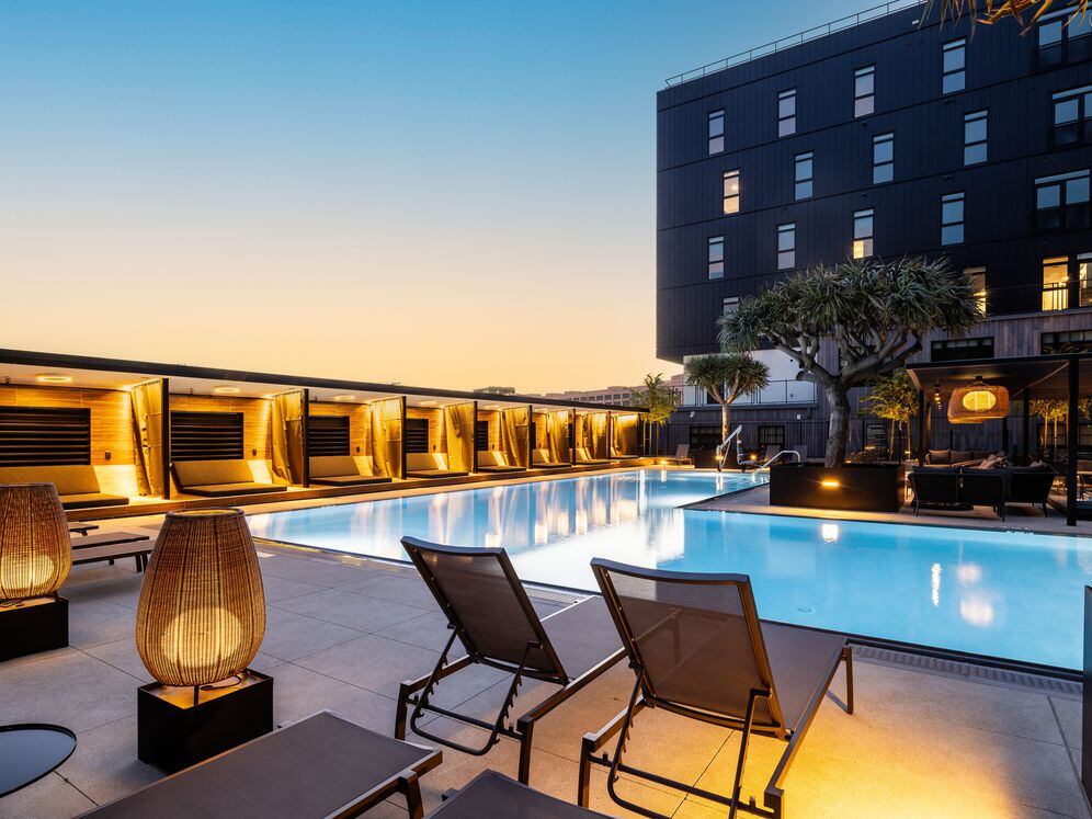 Pool and sundeck with cabanas