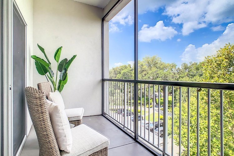 Enjoy the outdoors with a view from the privacy of your very own screened-in patio.