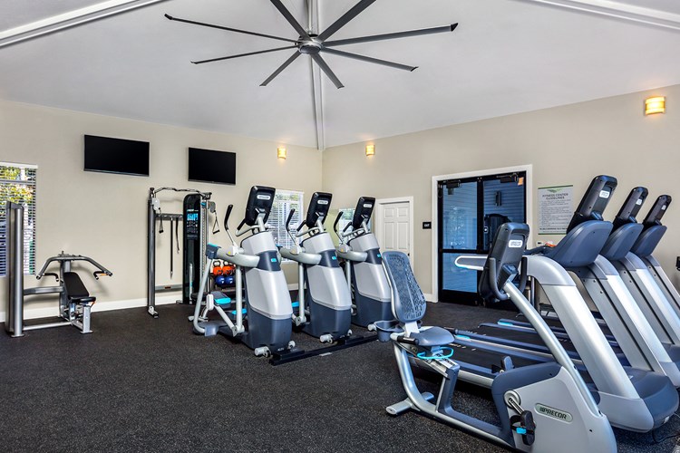 Brand new fitness center with cardio equipment, weight machines, and spin room