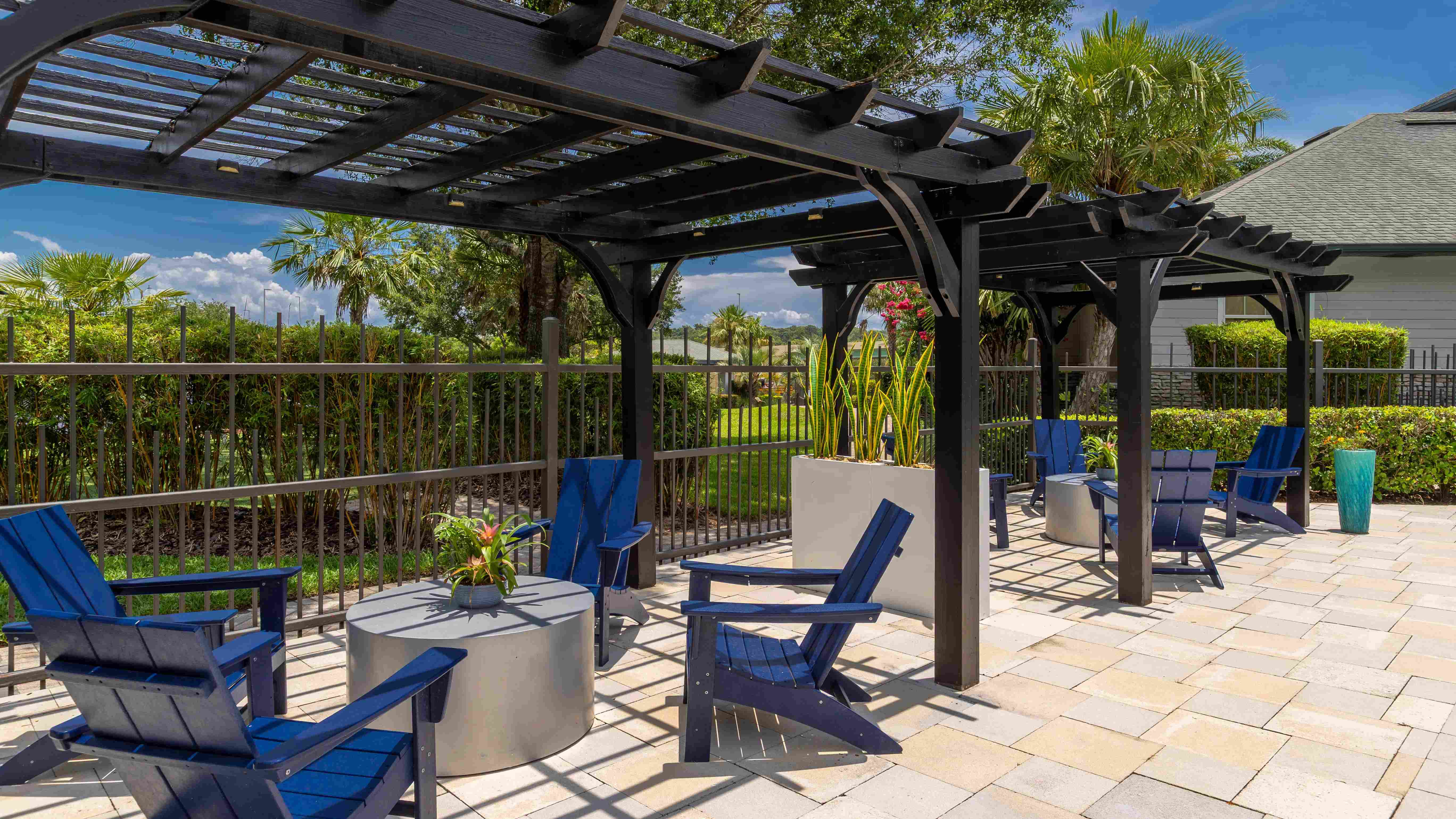 Unwind in the shade under our stylish pergolas—perfect for casual conversations, poolside reading, or soaking up the serene Florida breeze.