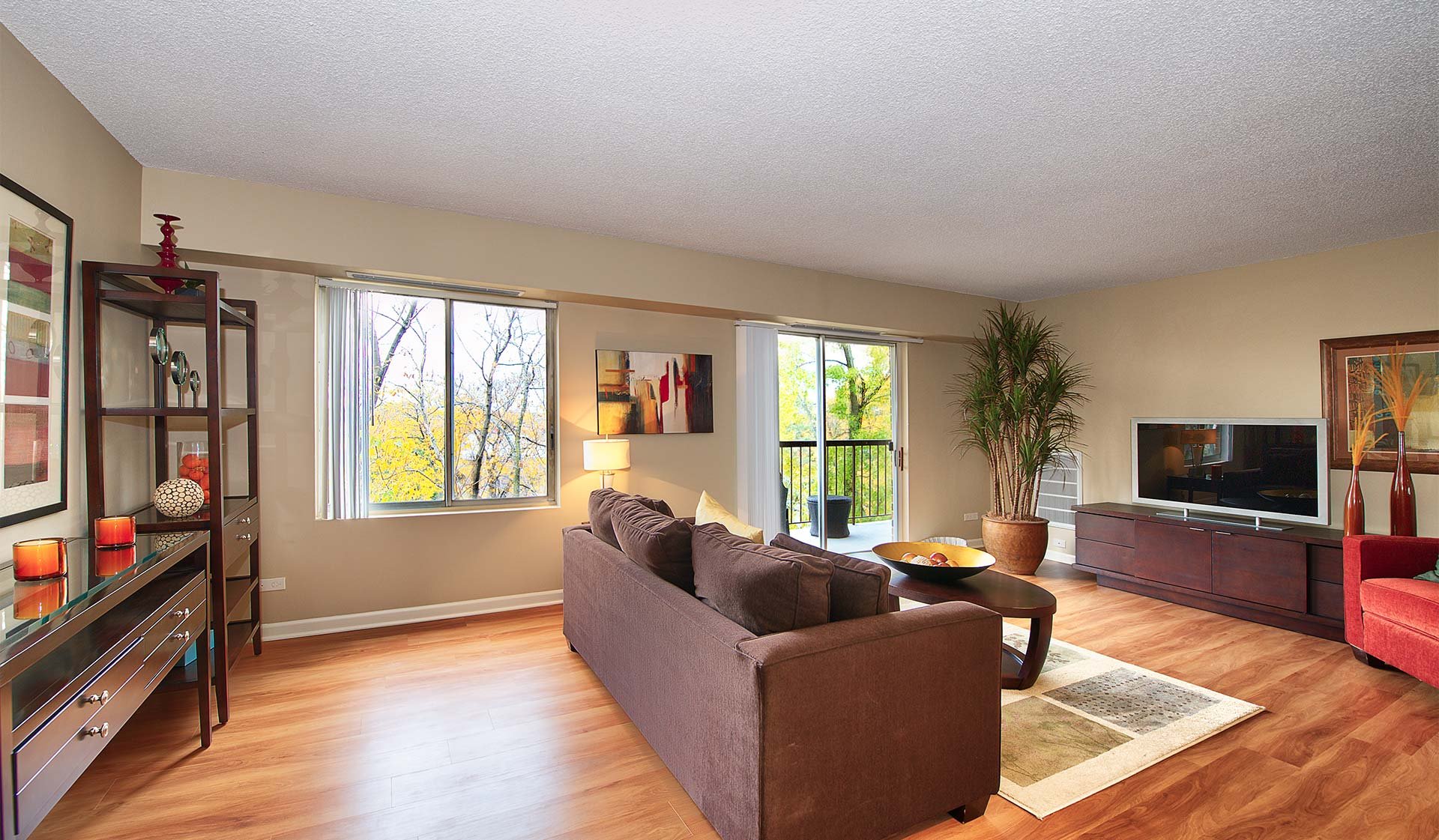 Spacious living room has balcony access