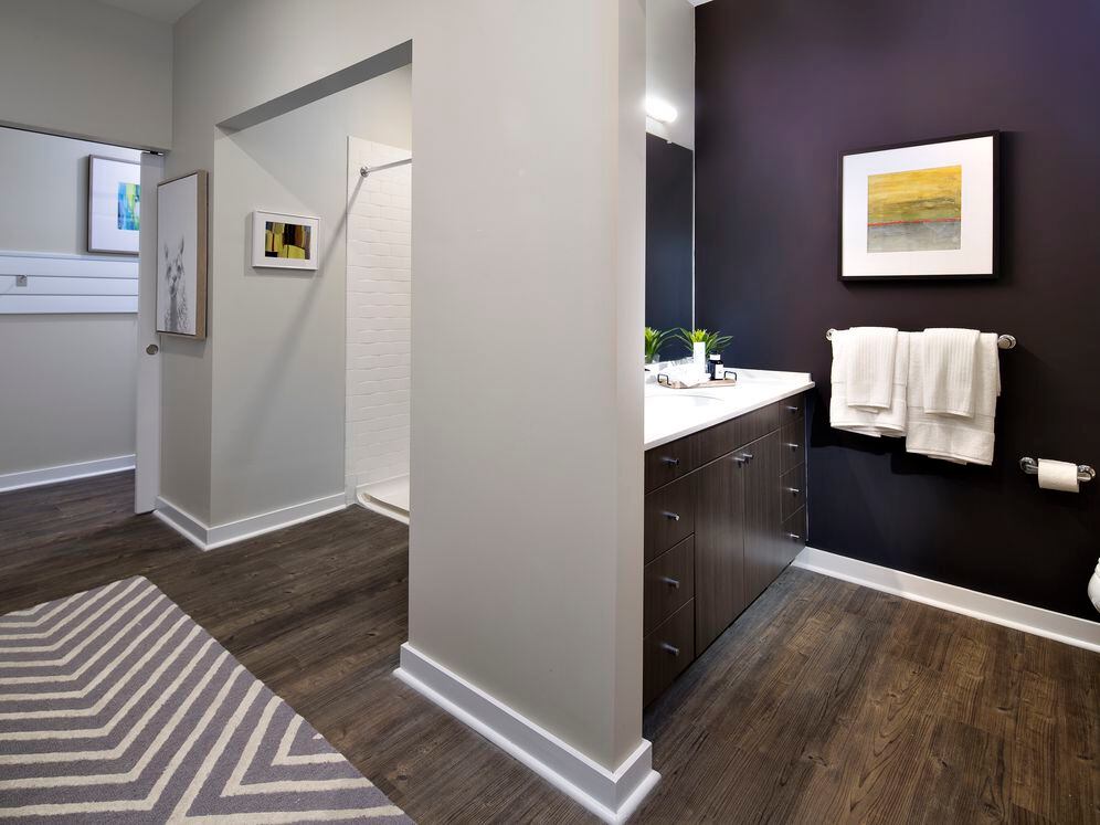 Modern Package bath with dark brown cabinetry, white quartz countertops, and hard surface flooring